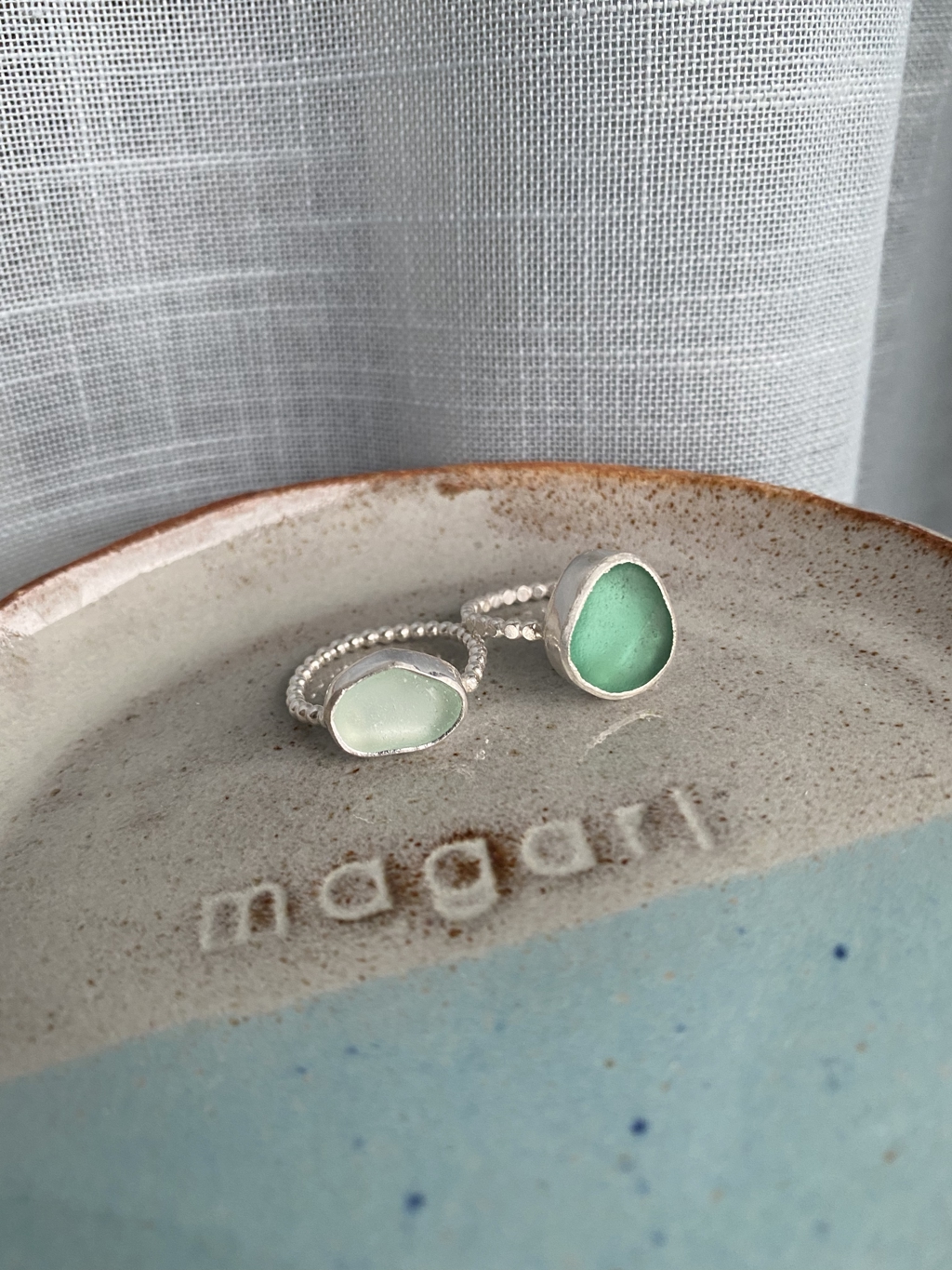 A precious silver ring made with sea glass. You can choose the sea glass colour and shape.<br />You can also choose if you want a beaded ring or a ring with a hammered finish.